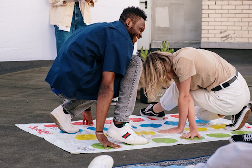 Family members playing a colorful outdoor game together